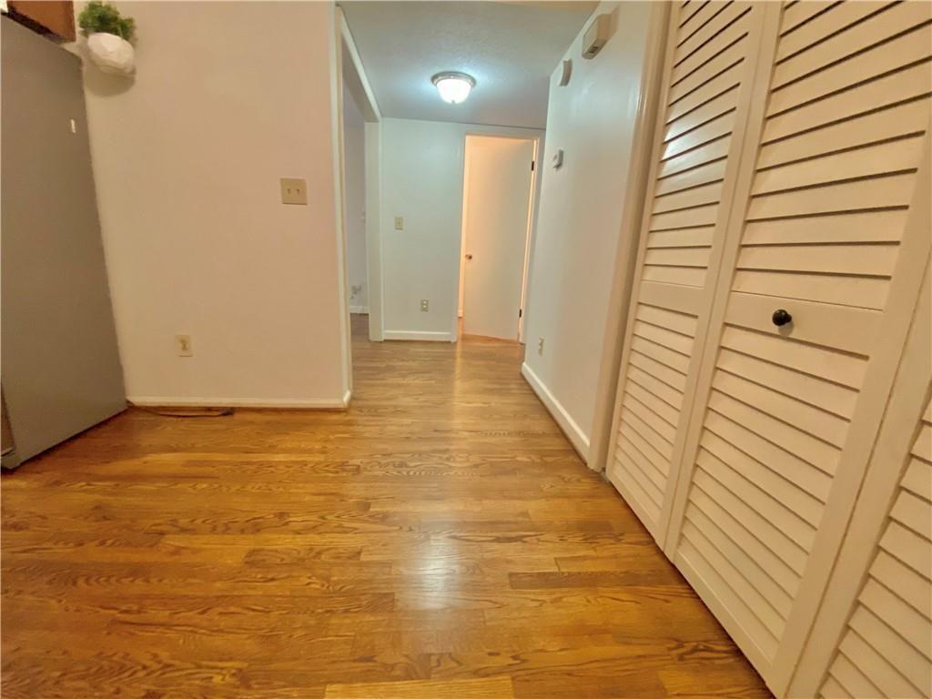 1148 Riverbend Club Drive Southeast Atlanta, GA 30339 - Photo 12 of 51 a view of a hallway with wooden floor