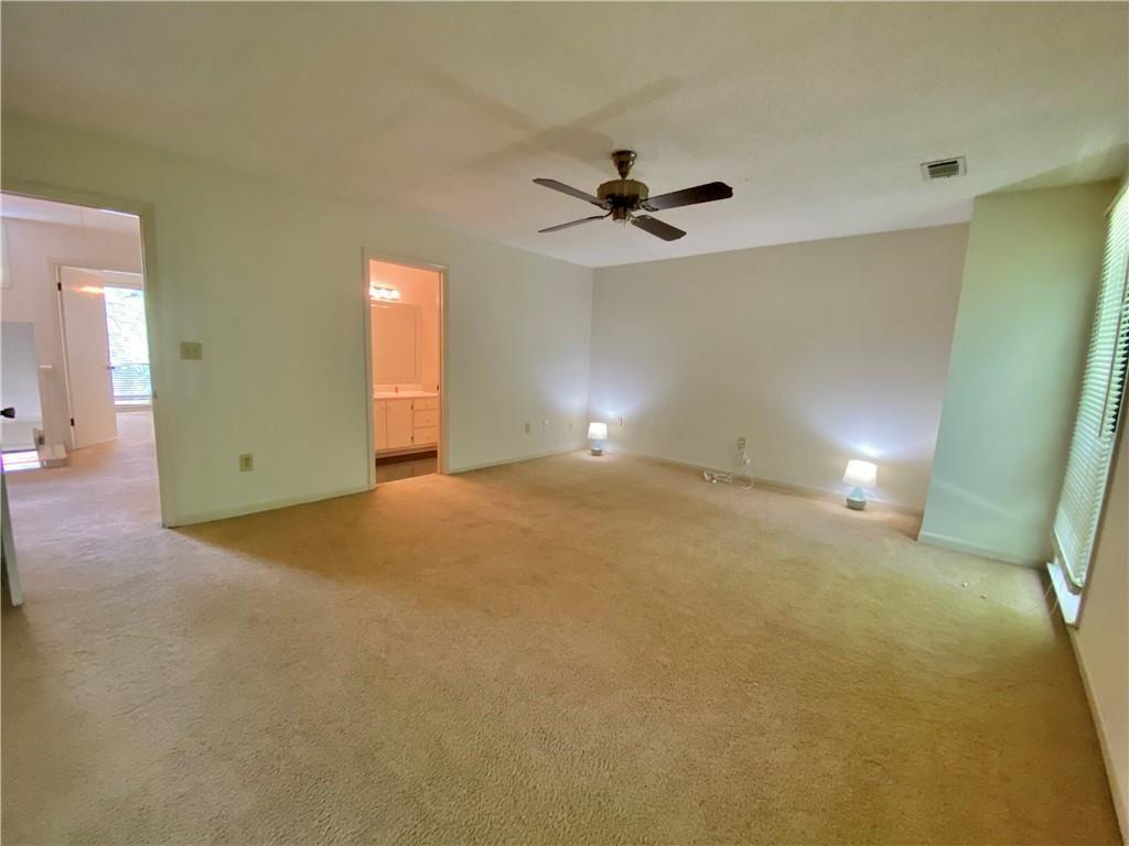 1148 Riverbend Club Drive Southeast Atlanta, GA 30339 - Photo 25 of 51 a view of a big room with carpet