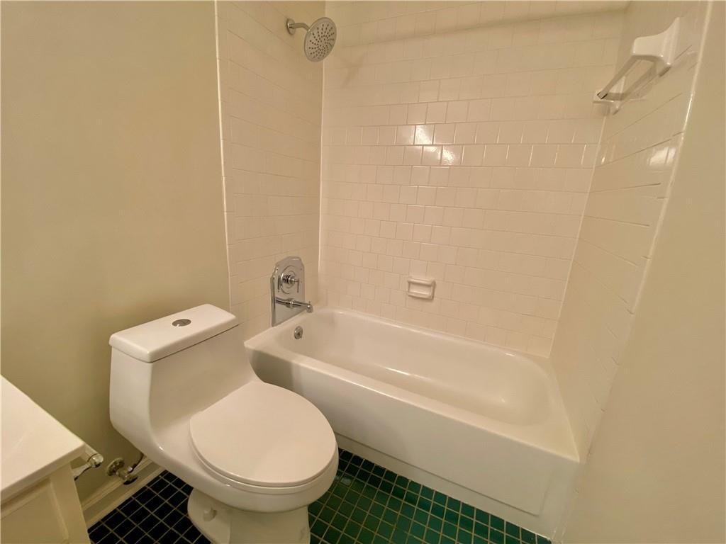 1148 Riverbend Club Drive Southeast Atlanta, GA 30339 - Photo 27 of 51 a bathroom with a toilet and a bathtub