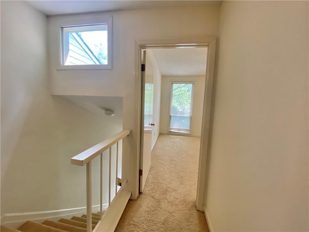 1148 Riverbend Club Drive Southeast Atlanta, GA 30339 - Photo 29 of 51 a view of a hallway with a window