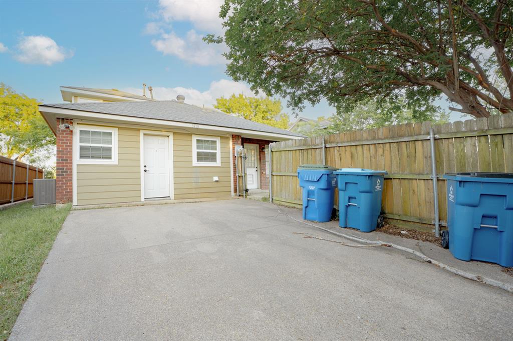 3721 Smartt Street Rowlett, TX 75088 - Photo 24 of 27 front view of a house with a fence
