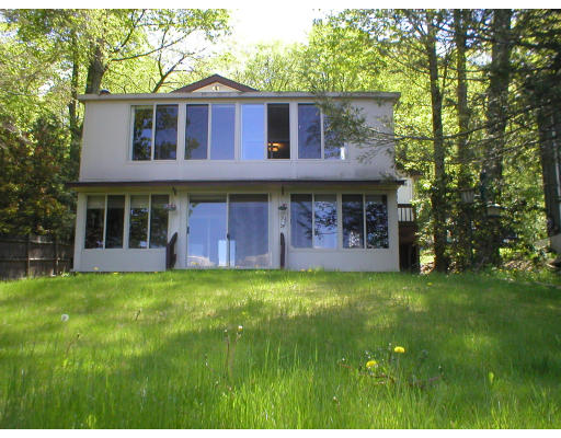 174 Manchaug Road Sutton, MA 01590 - Photo 2 of 7 a view of a house with a yard