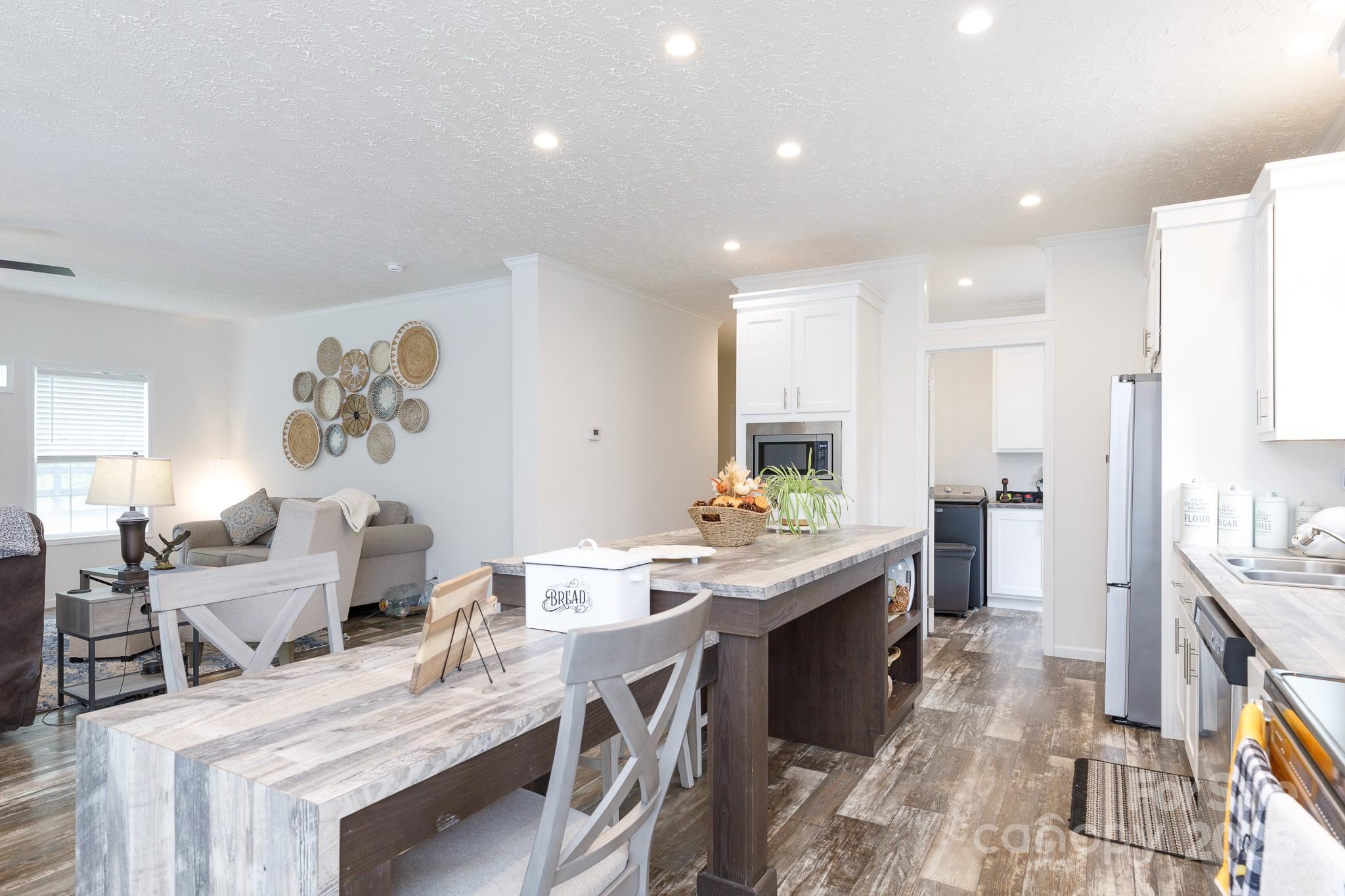 4575 Cureton Ferry Road Catawba, SC 29704 - Photo 14 of 42 a large kitchen with stainless steel appliances lots of counter space and breakfast area