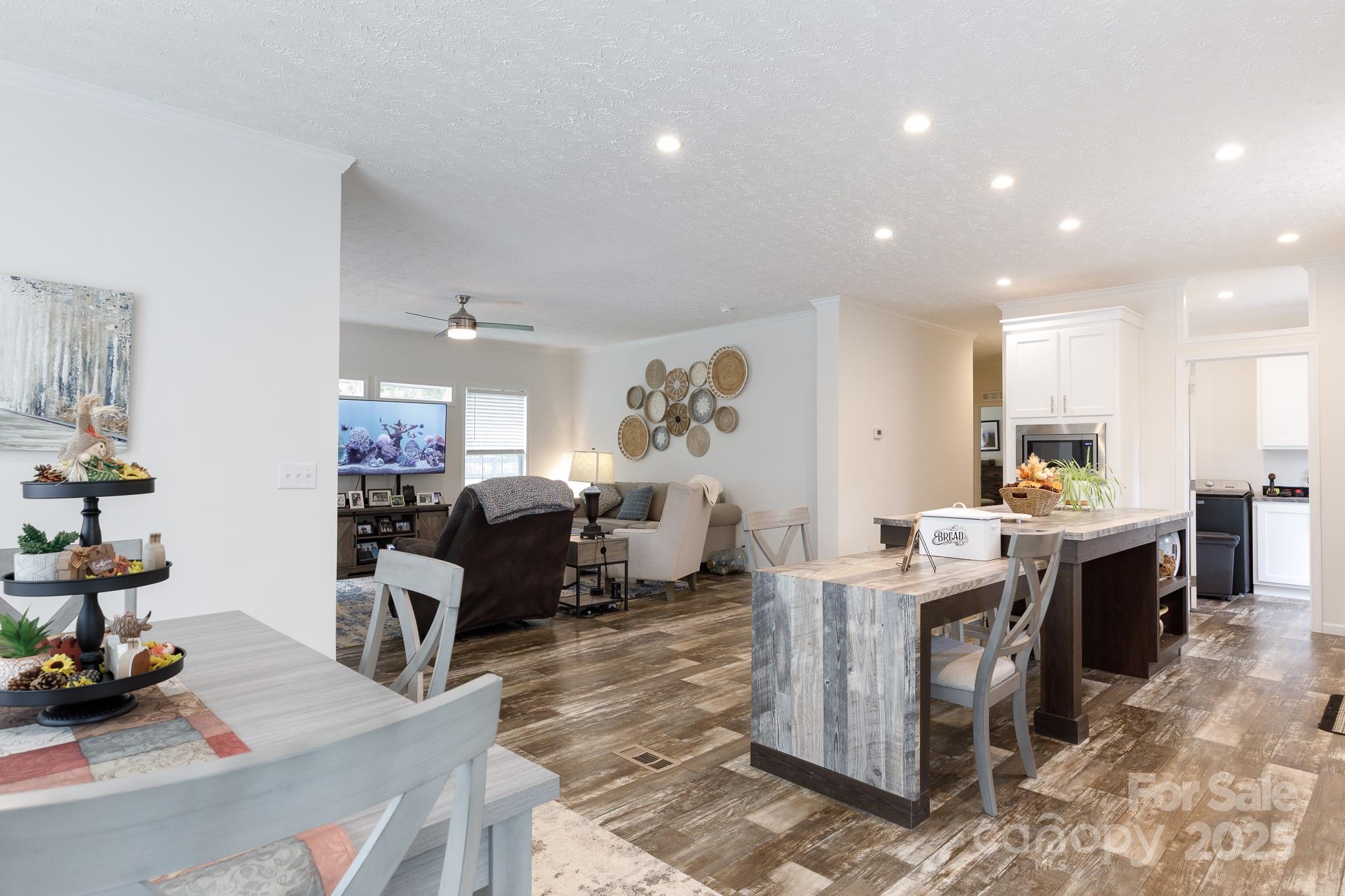 4575 Cureton Ferry Road Catawba, SC 29704 - Photo 15 of 42 a living room with kitchen island furniture and a kitchen view