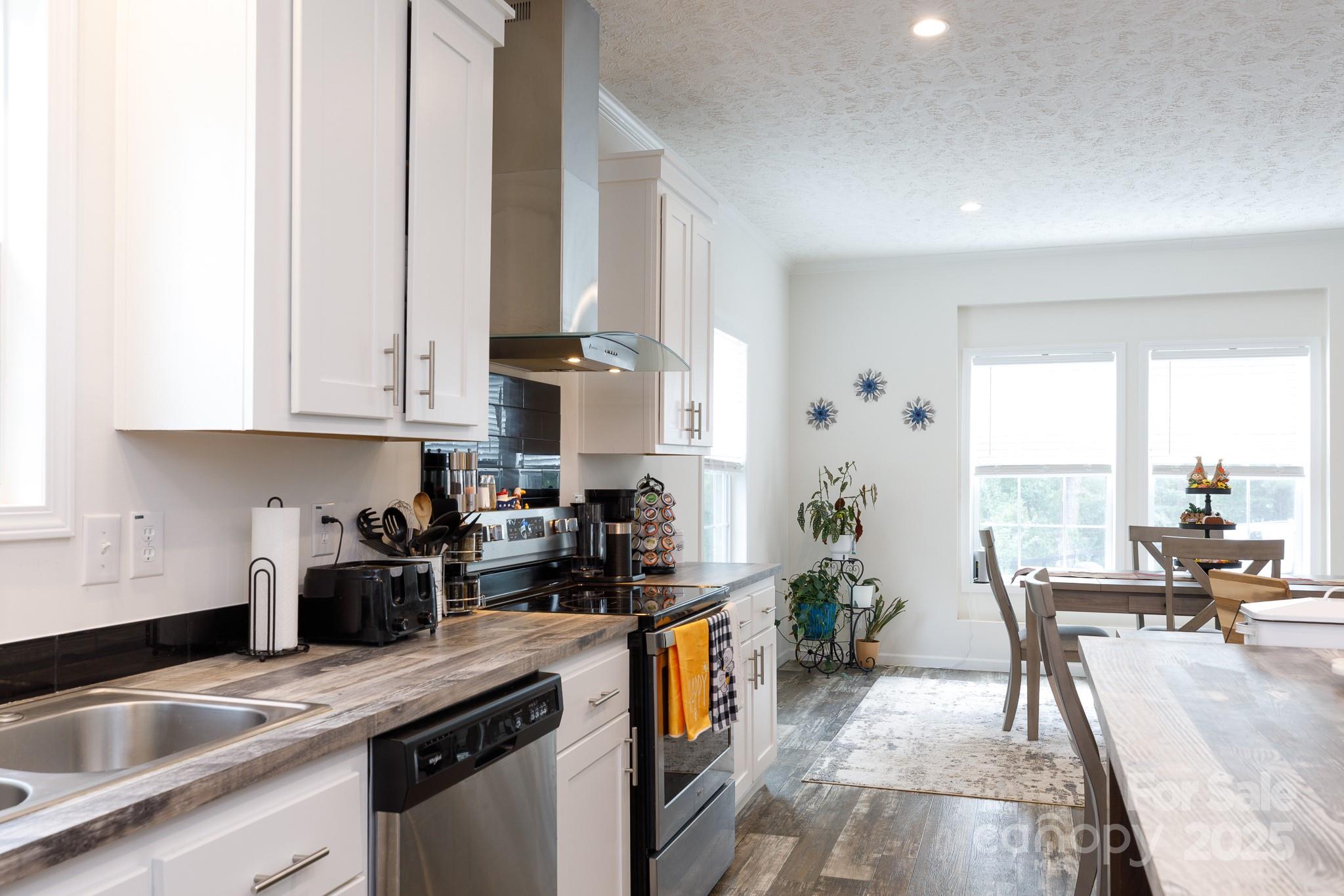 4575 Cureton Ferry Road Catawba, SC 29704 - Photo 16 of 42 a kitchen with stainless steel appliances granite countertop a sink a stove and a refrigerator