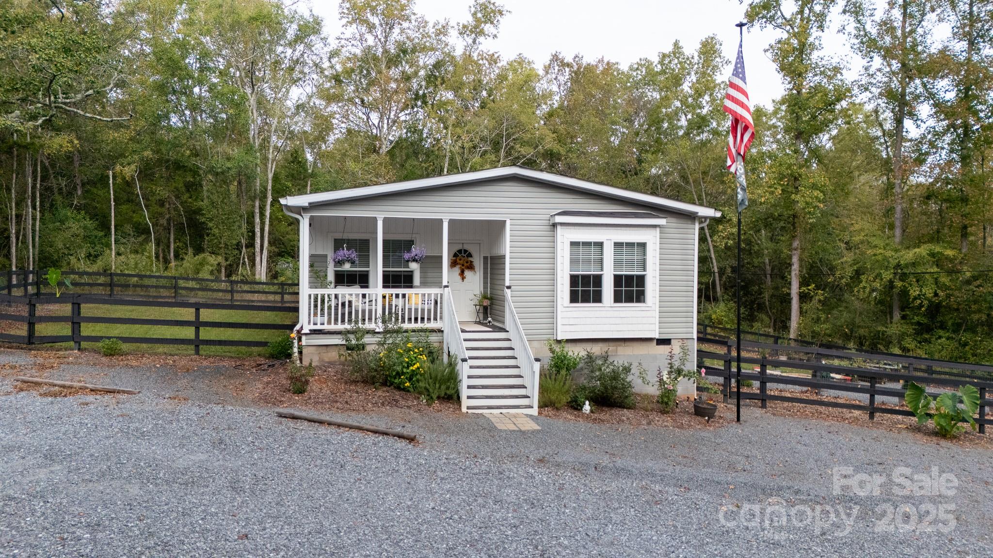 4575 Cureton Ferry Road Catawba, SC 29704 - Photo 28 of 42 a front view of a house with a yard