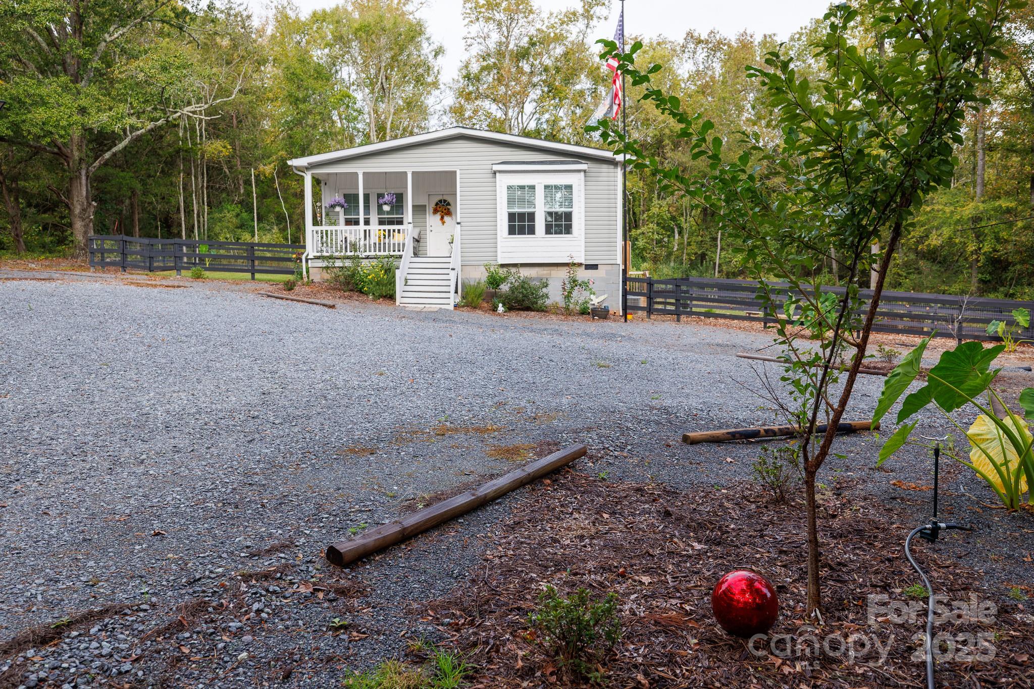 4575 Cureton Ferry Road Catawba, SC 29704 - Photo 29 of 42 a view of a house with a backyard