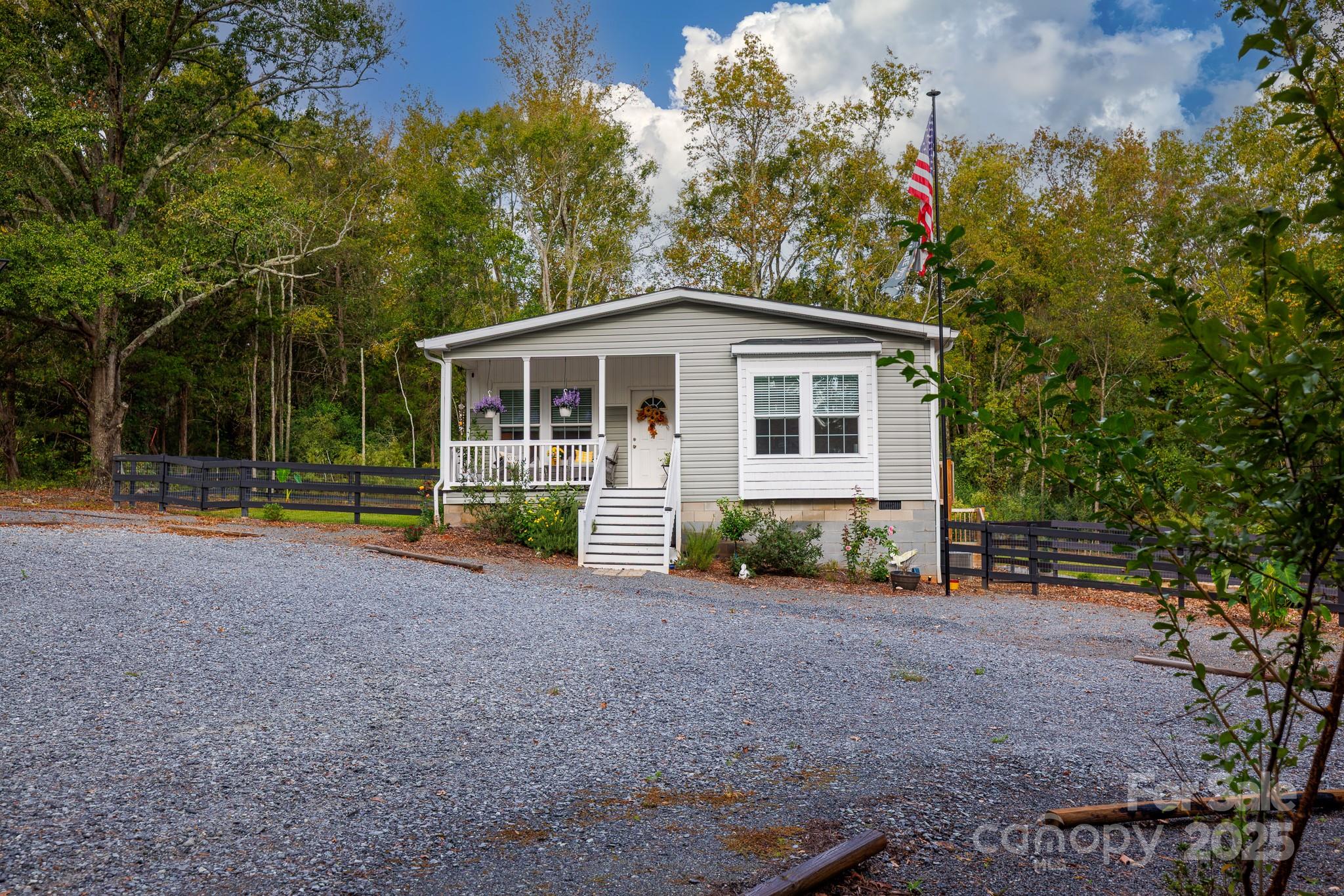 4575 Cureton Ferry Road Catawba, SC 29704 - Photo 30 of 42 a view of a house with a yard and large tree