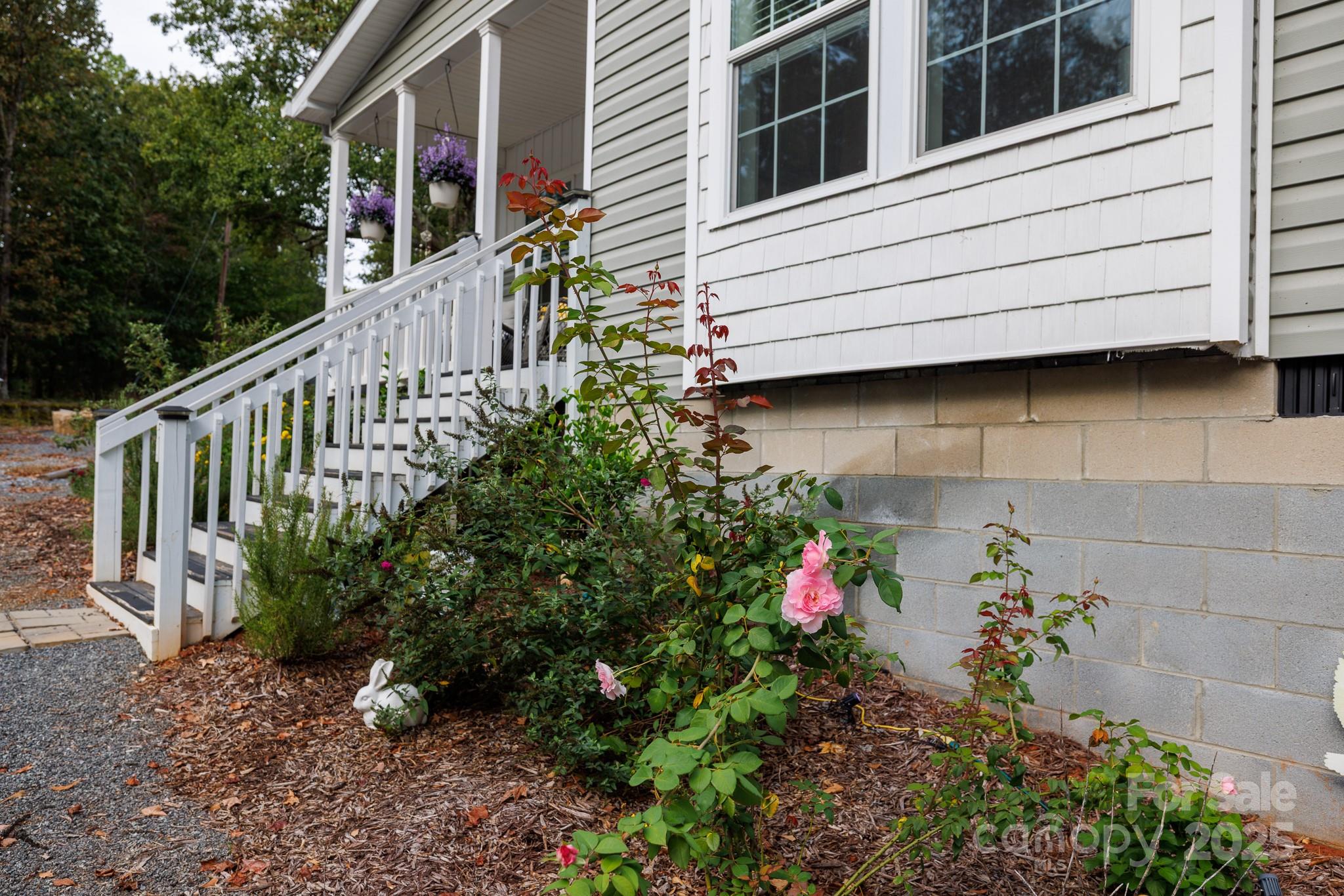 4575 Cureton Ferry Road Catawba, SC 29704 - Photo 32 of 42 a view of a house with a flower garden