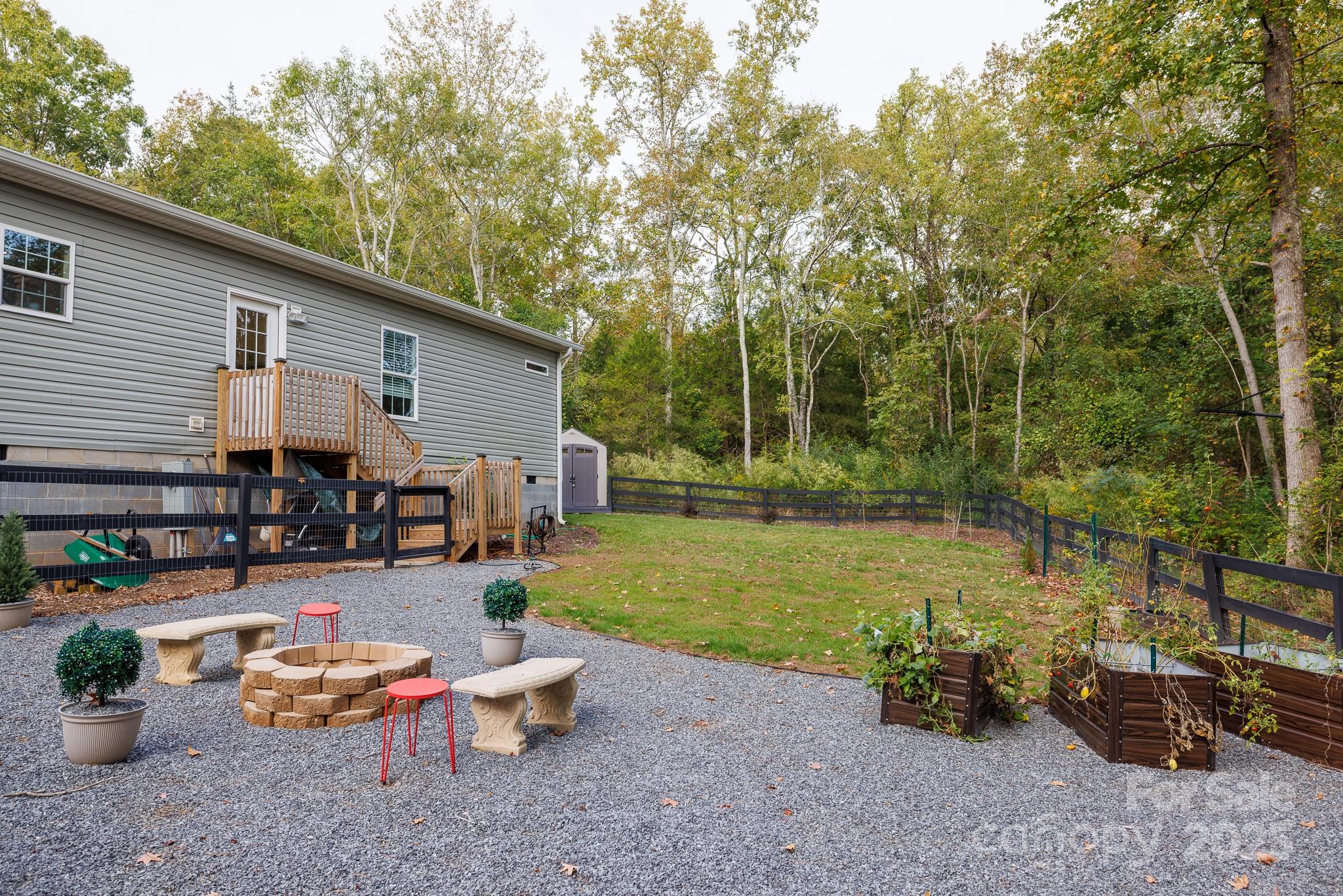 4575 Cureton Ferry Road Catawba, SC 29704 - Photo 40 of 42 a backyard of a house with outdoor seating