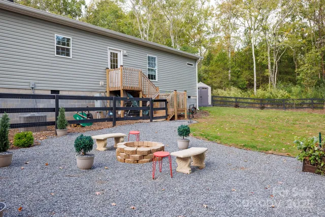 a view of a backyard with plants and a patio