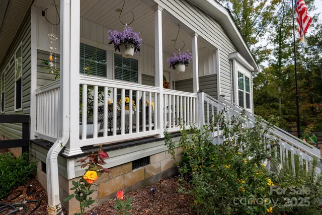 a view of a house with backyard and porch