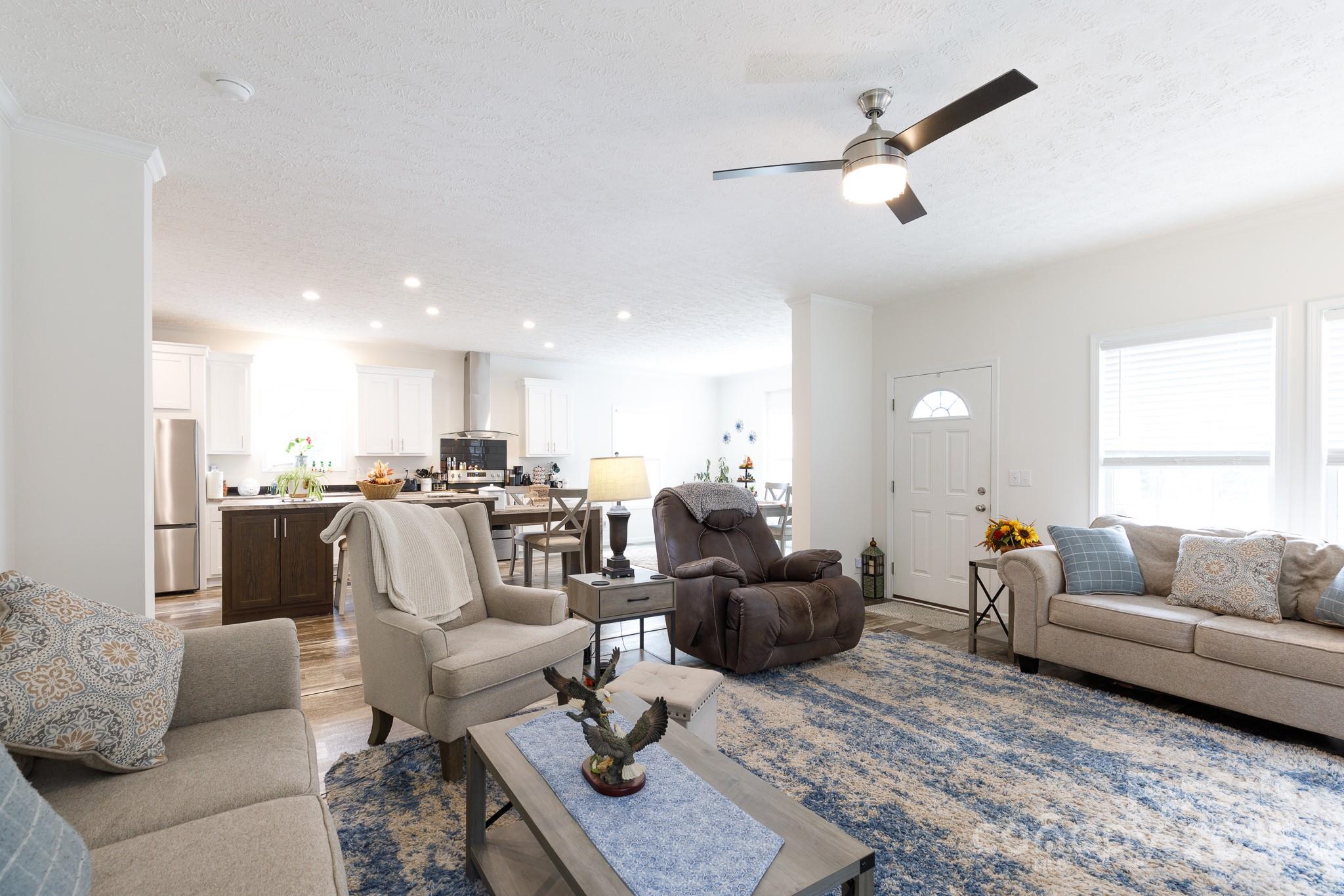 4575 Cureton Ferry Road Catawba, SC 29704 - Photo 9 of 42 a living room with furniture and a view of kitchen