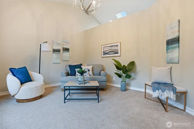 a living room with furniture and a lamp