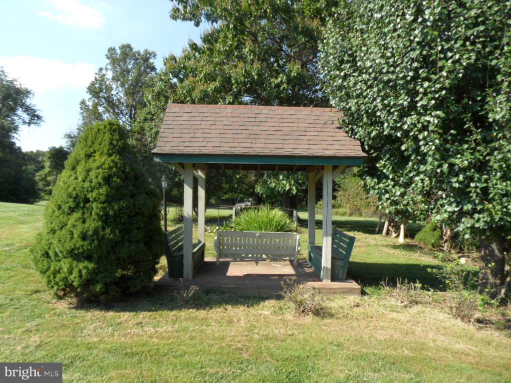 1709 Oakmont Road Fallston, MD 21047 - Photo 25 of 30 a backyard of a house with yard and outdoor seating