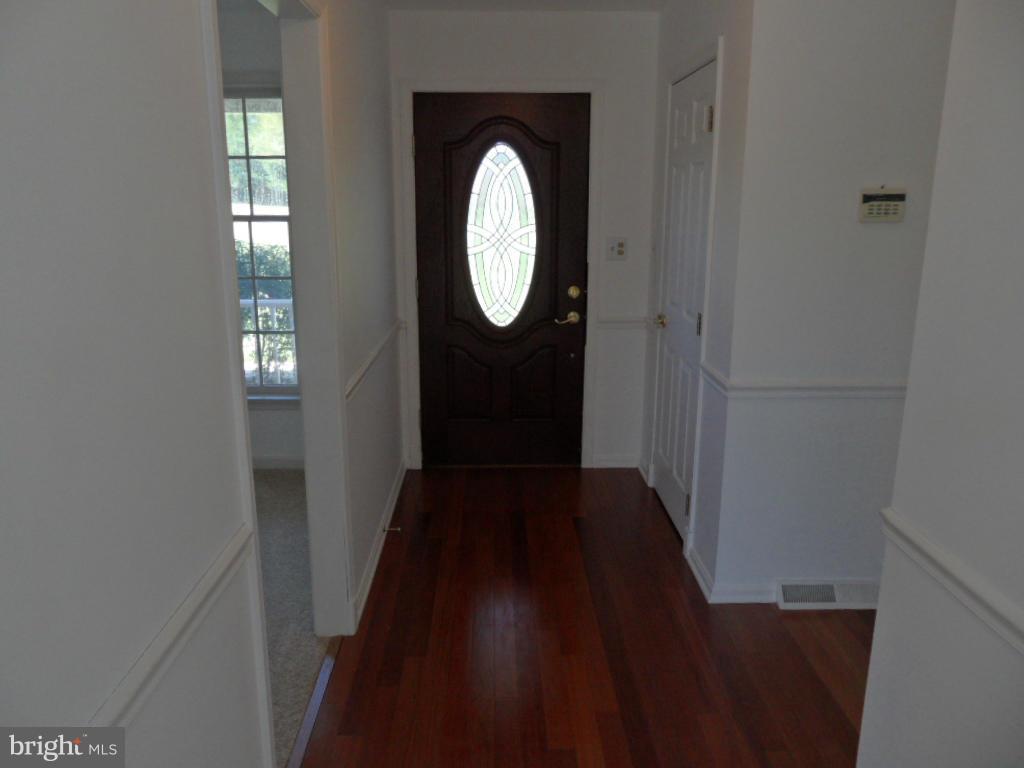 1709 Oakmont Road Fallston, MD 21047 - Photo 4 of 30 a view of a hallway with wooden floor