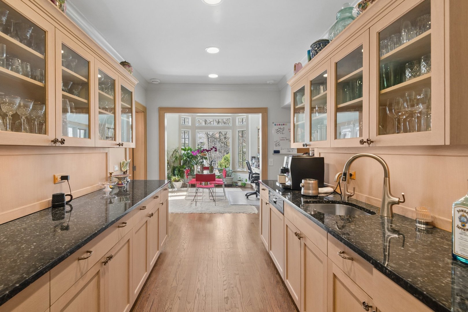 321 Woodland Road Highland Park, IL 60035 - Photo 12 of 48 a kitchen with a sink stove and cabinets