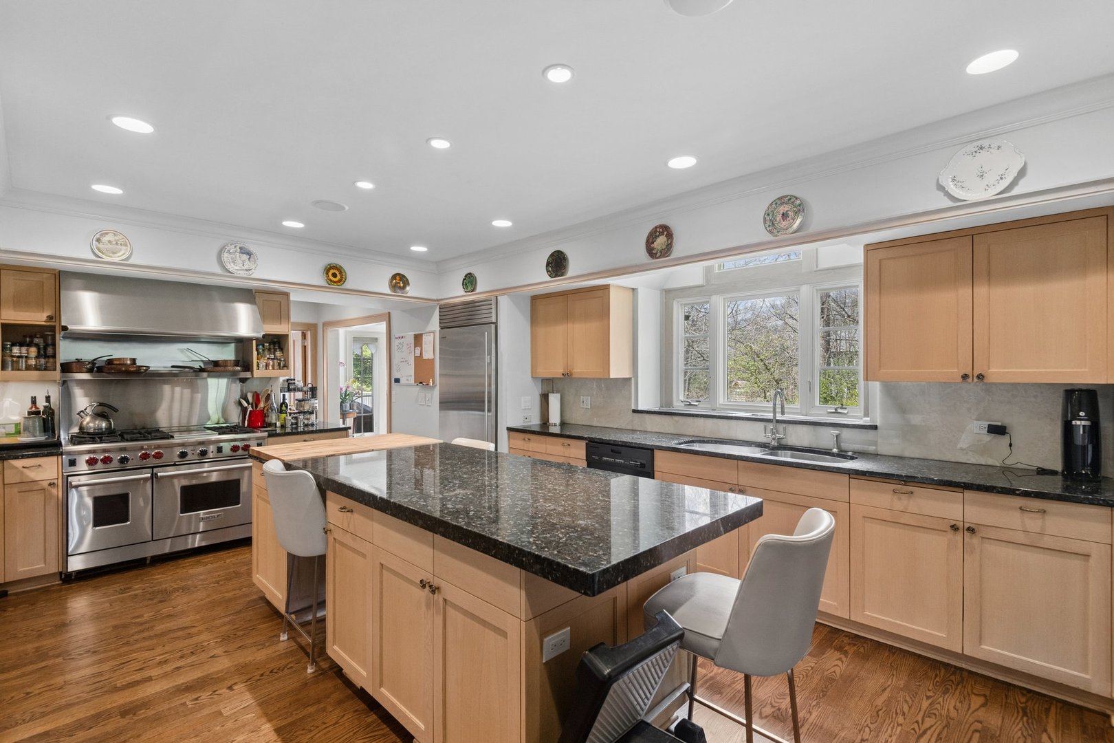321 Woodland Road Highland Park, IL 60035 - Photo 16 of 48 a kitchen with stainless steel appliances granite countertop a sink and a stove