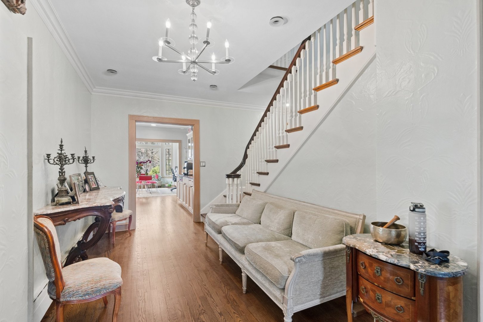 321 Woodland Road Highland Park, IL 60035 - Photo 21 of 48 a living room with furniture and a chandelier
