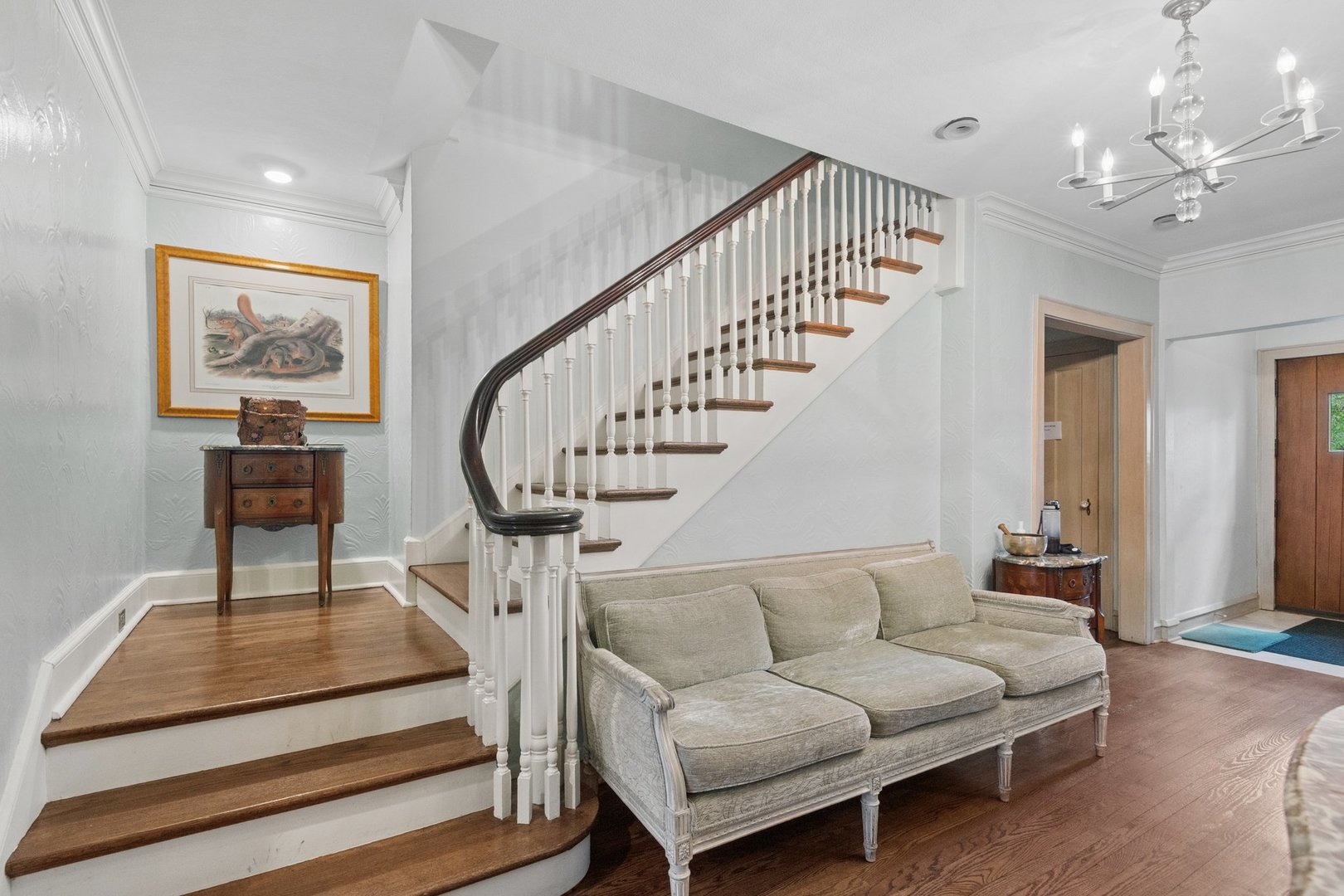 321 Woodland Road Highland Park, IL 60035 - Photo 23 of 48 a living room with furniture a fireplace and a chandelier