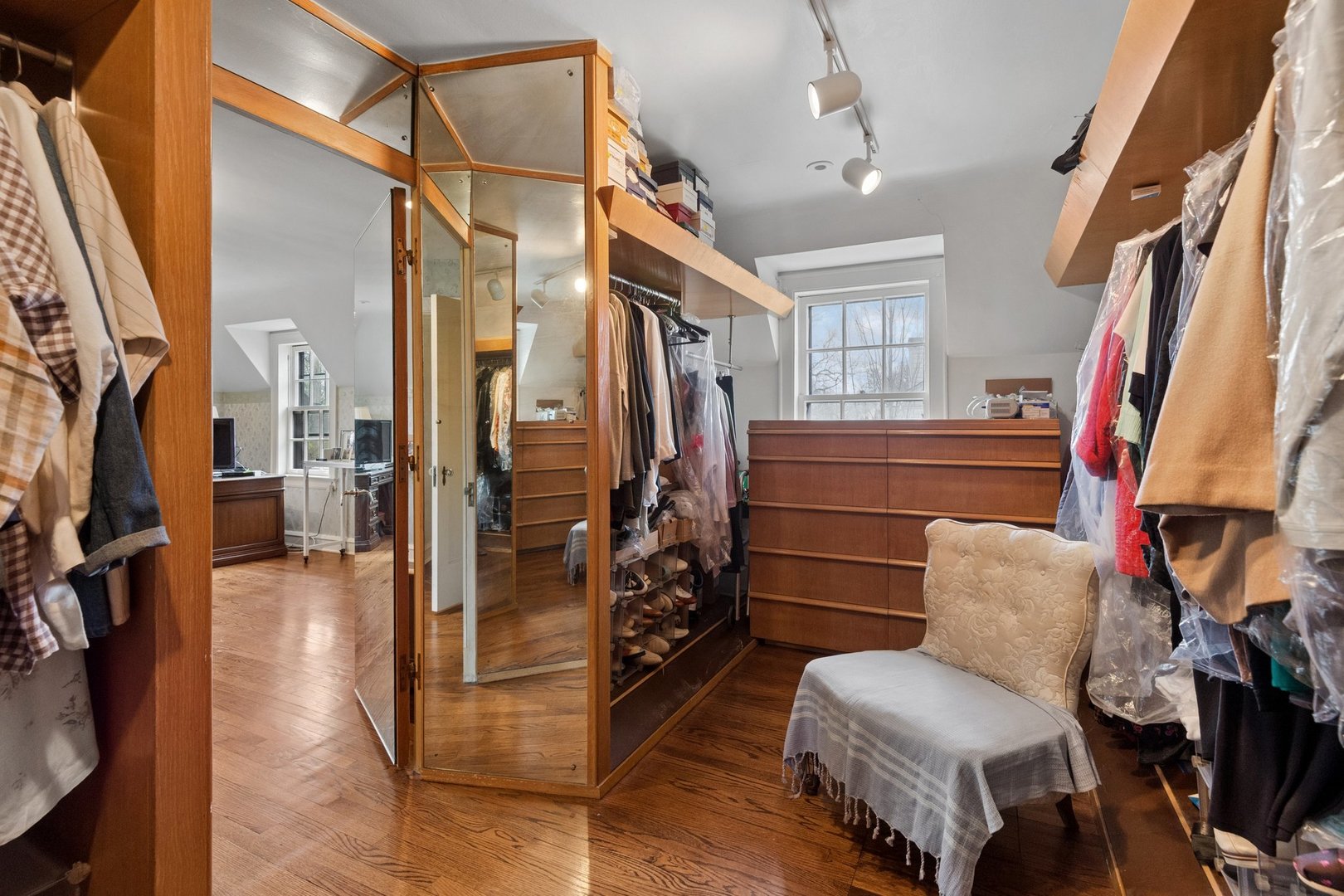 321 Woodland Road Highland Park, IL 60035 - Photo 29 of 48 a view of walk in closet with clothes and shoes