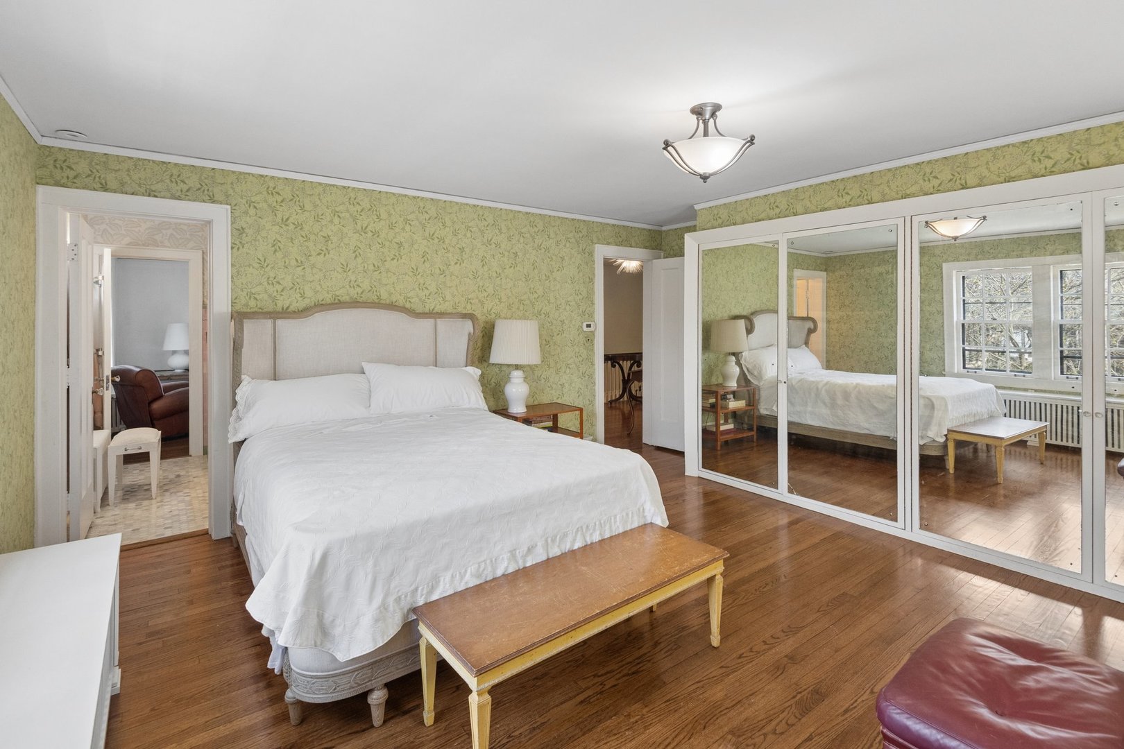 321 Woodland Road Highland Park, IL 60035 - Photo 32 of 48 a bedroom with a bed and wooden floor
