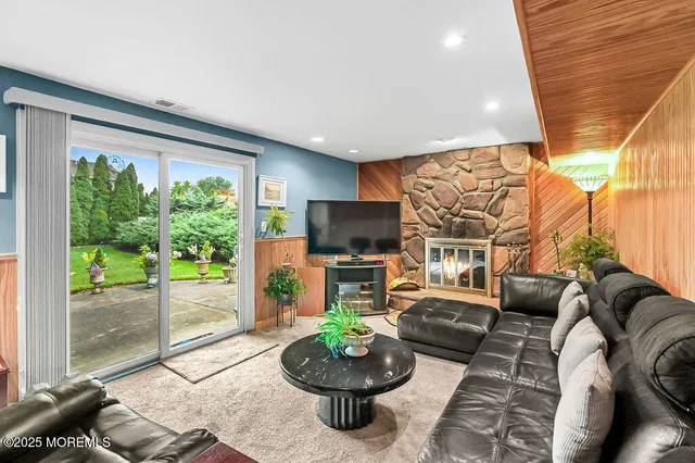 a living room with a couch and a fireplace
