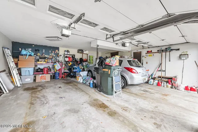 a view of a house with a big yard and large trees