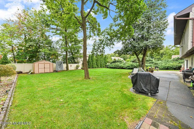 a view of a backyard with sitting area