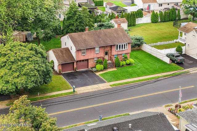 an aerial view of a house with a garden