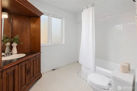 a reading room with furniture and wooden floor