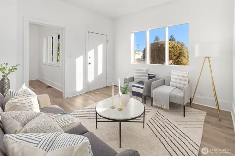 a dining room with furniture and wooden floor