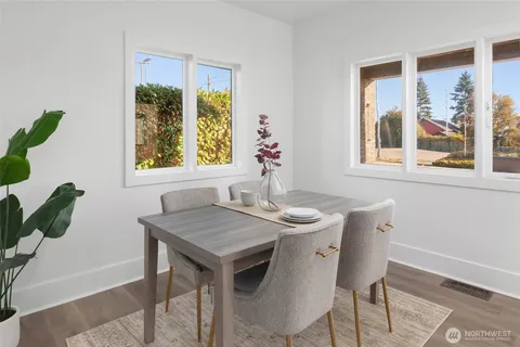 a view of a dining room with furniture and window