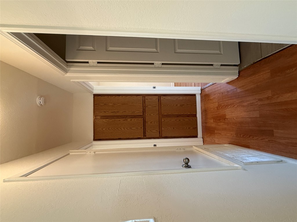 314 Raintree Drive Georgetown, TX 78626 - Photo 4 of 13 a view of a hallway with wooden floor and entryway