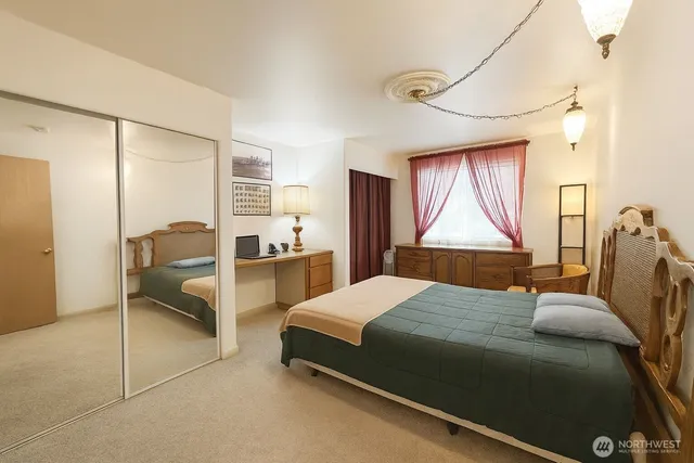 a living room with furniture and kitchen view