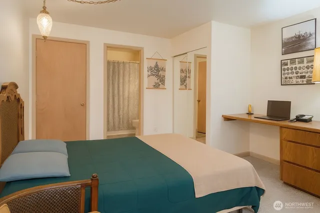 a kitchen with stainless steel appliances granite countertop a refrigerator a sink dishwasher a stove and a refrigerator with wooden floor