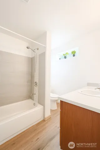 a kitchen with stainless steel appliances granite countertop a stove microwave and sink