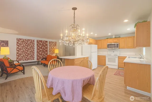 a view of an empty room and wooden floor