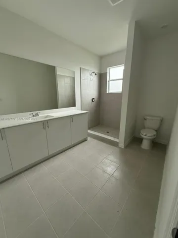 a bathroom with a sink and toilet