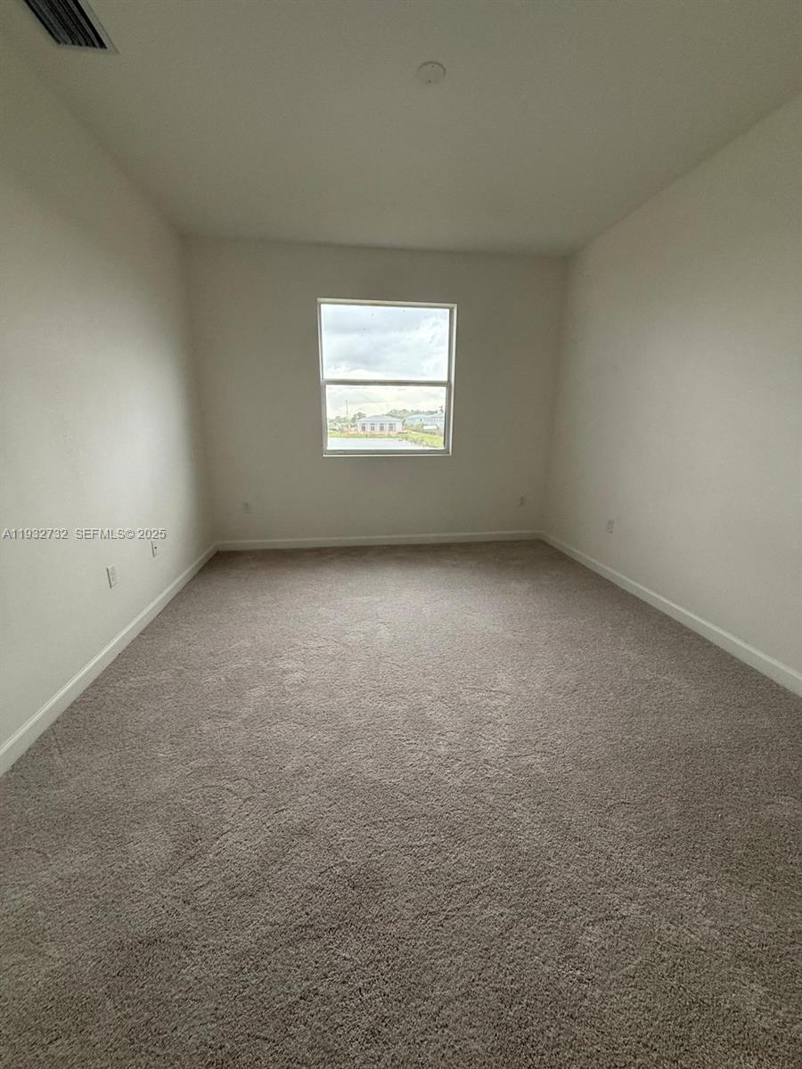 35844 Southwest 178th Court Homestead, FL 33034 - Photo 12 of 17 an empty room with a window