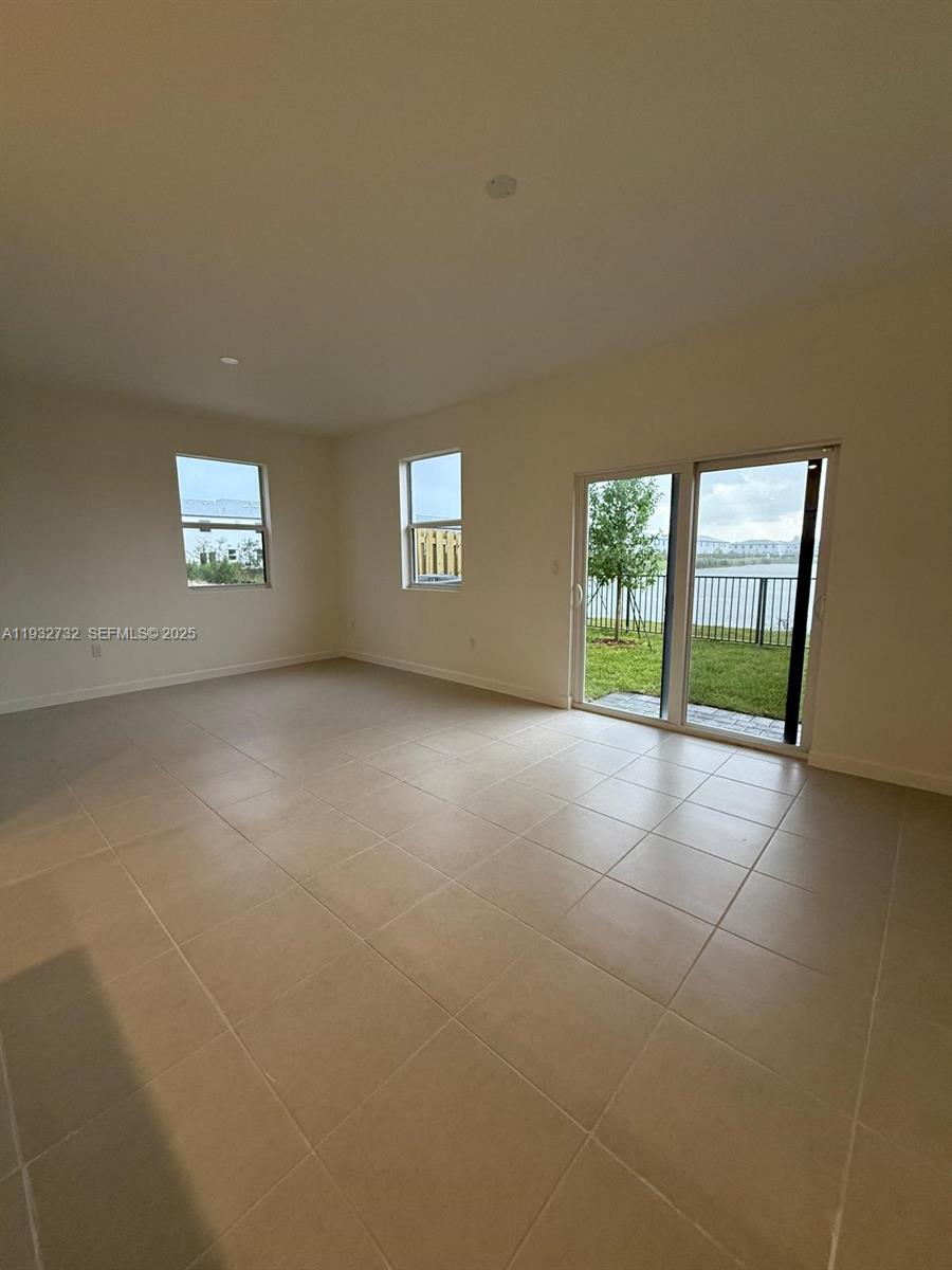 35844 Southwest 178th Court Homestead, FL 33034 - Photo 2 of 17 a view of an empty room with a window