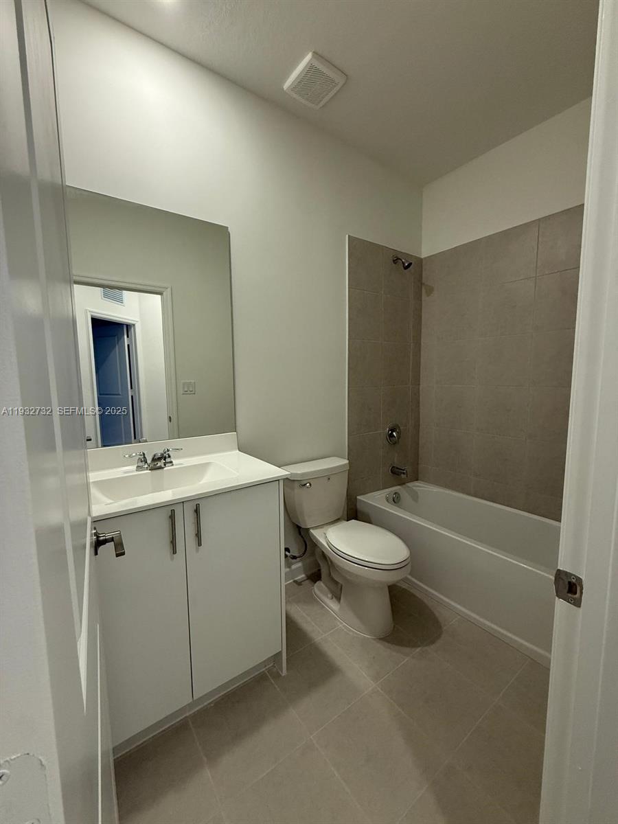35844 Southwest 178th Court Homestead, FL 33034 - Photo 8 of 17 a bathroom with a granite countertop sink toilet and shower