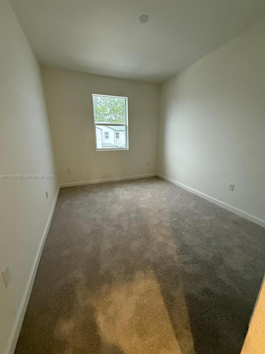 35844 Southwest 178th Court Homestead, FL 33034 - Photo 9 of 17 an empty room with a window