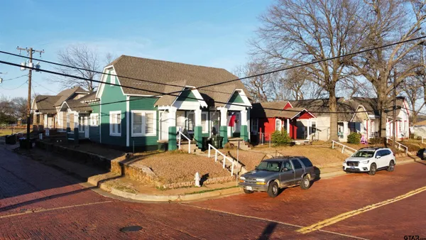 a view of a patio with a table and chairs