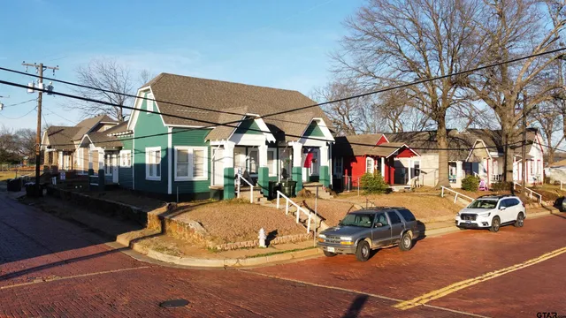 a view of a patio with a table and chairs
