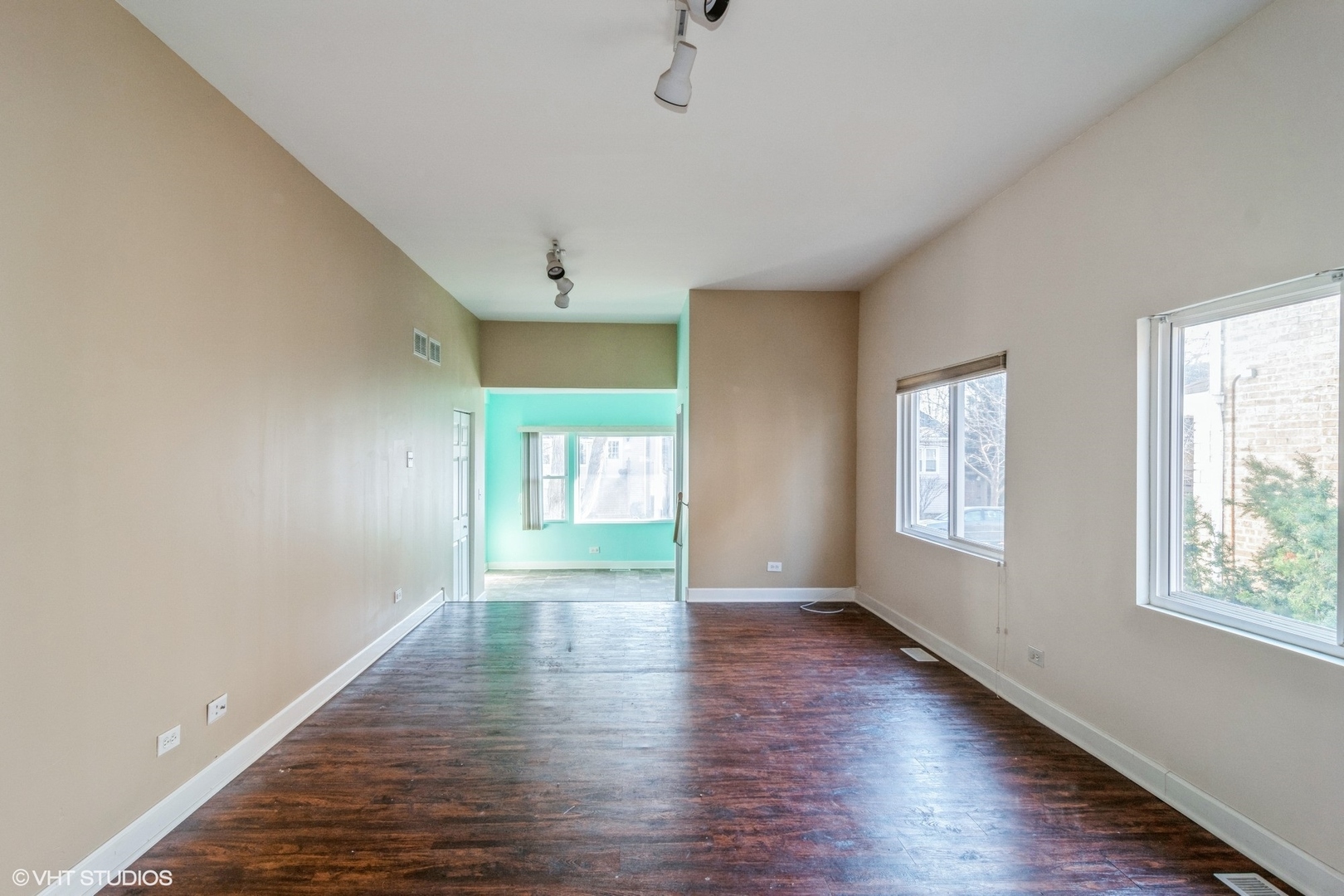 905 Thomas Avenue, Unit 1 Forest Park, IL 60130 - Photo 5 of 15 a view of an empty room with a window and wooden floor