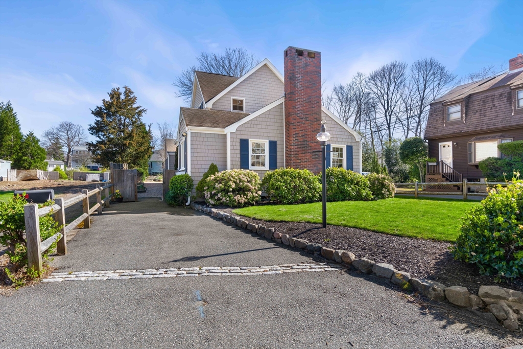 153 Jersey Street Marblehead, MA 01945 - Photo 2 of 34 a view of a house next to a yard