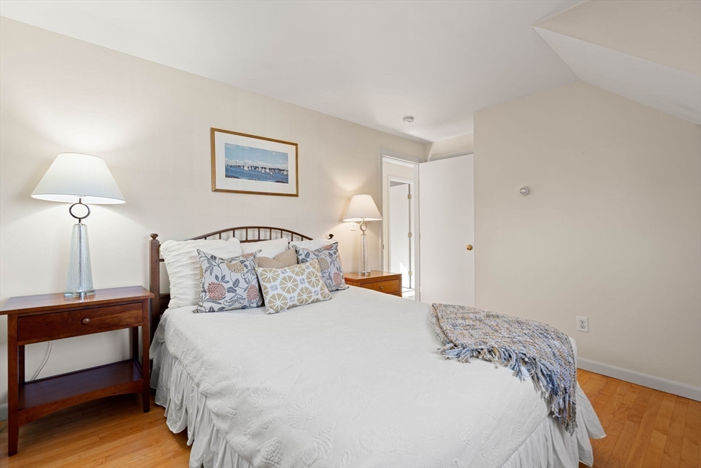153 Jersey Street Marblehead, MA 01945 - Photo 24 of 34 a bedroom with a bed and a lamp
