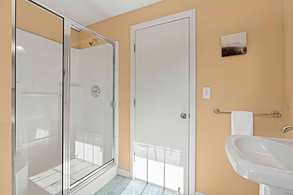 153 Jersey Street Marblehead, MA 01945 - Photo 26 of 34 a bathroom with a sink and a mirror