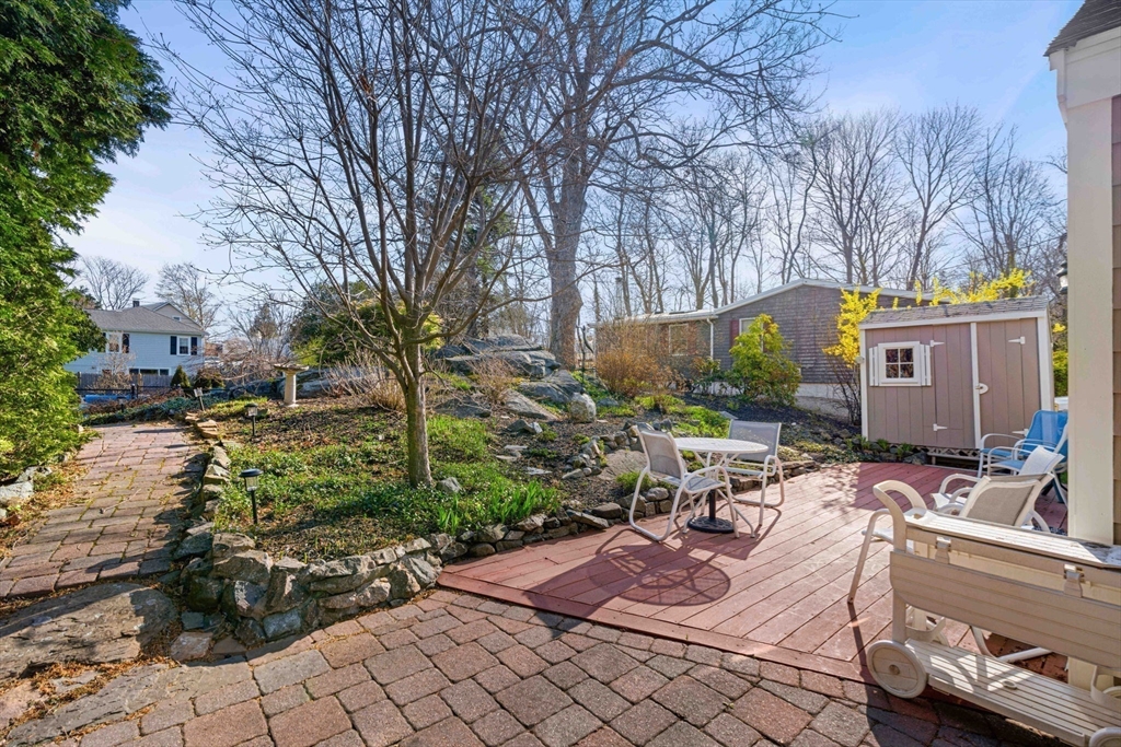 153 Jersey Street Marblehead, MA 01945 - Photo 28 of 34 a view of a patio with table and chairs and potted plants